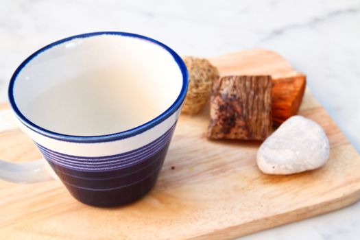 empty cup on chopping board