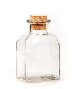 blank glass bottle with cork stopper on white