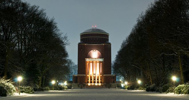 Hamburg Planetarium on a winter evening. Everything in the snow with the fascinating illumination.