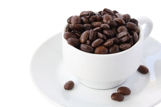 White coffee cup with whole coffe beans