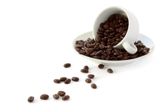 White coffee cup with whole coffe beans