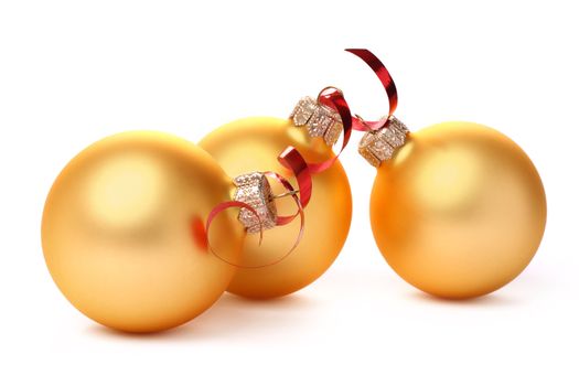 Yellow Christmas balls with a red tape