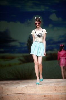 ZAGREB, CROATIA - MARCH 23: Fashion model wears clothes made by ELFS on "CRO A PORTER" show on March 23, 2012 in Zagreb, Croatia.