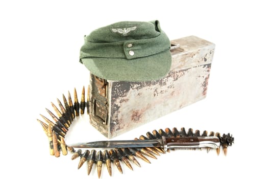 Kepi of the German soldier and machine-gun tape on a white background