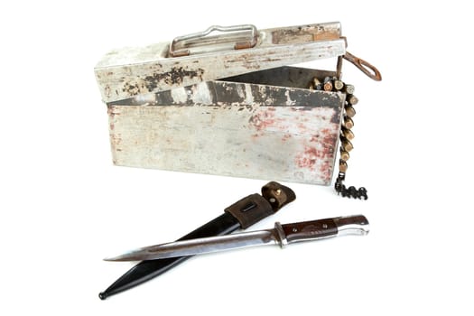 Aluminium box with a machine-gun tape and bayonet-knife on  white background