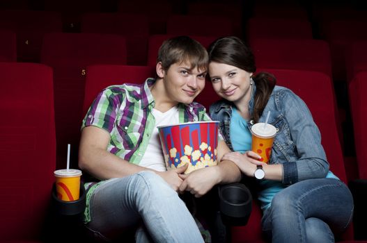 couple in a movie theater, watching a movie