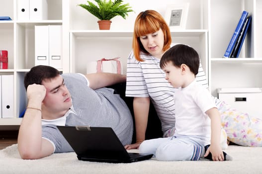 Family looking at a laptop, a rest home