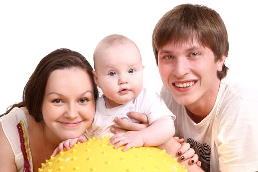 Portrait of a young family on a white background. The father, mum and the kid. A horizontal.