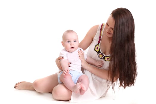 Young mum and the small son, portrait on a white background close up, the kid sits at mum in a lap, a format horizontal.