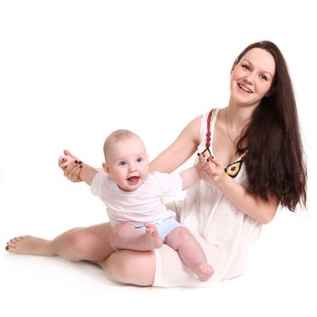 Young mum and the small son, portrait on a white background close up, the kid sits at mum in a lap, mum holds the kid for hands, a format square