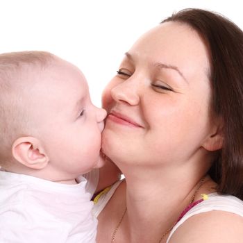 Young mum and the small son, portrait on a white background close up, the kid kisses mum, a format square.