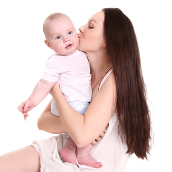 Young mum kisses the son on a cheek. A portrait on a white background