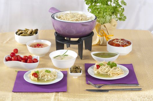 pasta  fondue with different sauces