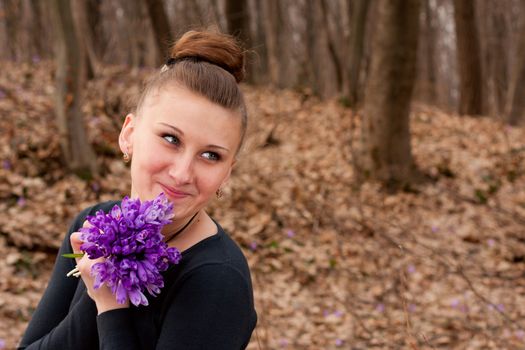 girl with snowdrops in the hands of