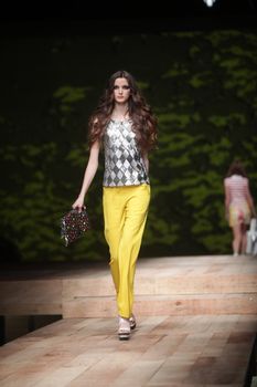 ZAGREB, CROATIA - MARCH 23: Fashion model wears clothes made by Monika Sablic on "CRO A PORTER" show on March 23, 2012 in Zagreb, Croatia.