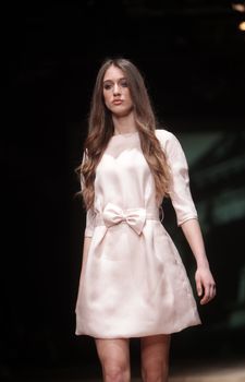 ZAGREB, CROATIA - MARCH 23: Fashion model wears clothes made by Monika Sablic on "CRO A PORTER" show on March 23, 2012 in Zagreb, Croatia.