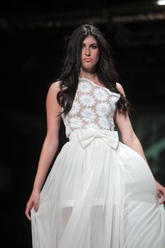 ZAGREB, CROATIA - MARCH 23: Fashion model wears clothes made by Monika Sablic on "CRO A PORTER" show on March 23, 2012 in Zagreb, Croatia.