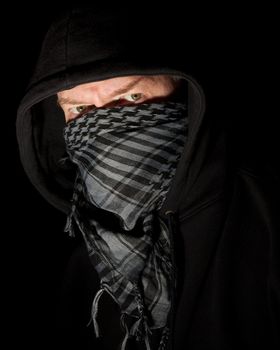 Masked robber portrait on black