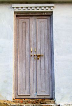 Wooden old door of ancient house