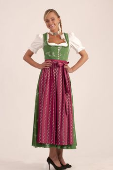 Portrait of a girl in the green Bavarian dirndl