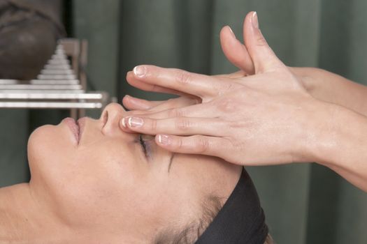 Young woman is recovering from a facial massage