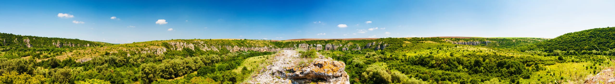 Panorama of the canyon of Rusenski Lom, Bulgaria. The wholes in the rocks are dwellings used as Hesychasm monastery