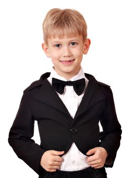 boy with tuxedo and bow tie posing