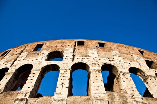 Colosseum in Rome with blue sky, landmark of the city