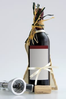 Wine bottle with corkscrew  and a cork