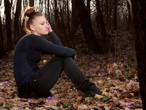 beautiful girl on the background of the spring forest