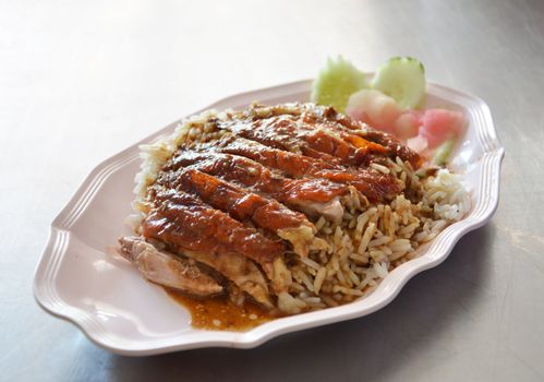  roast  duck over rice served with vegetable