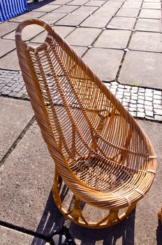 chair seat wicker from wooden tree twigs cane. hand made products sold at outside market fair