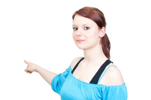 Young business woman pointing towards copyspace