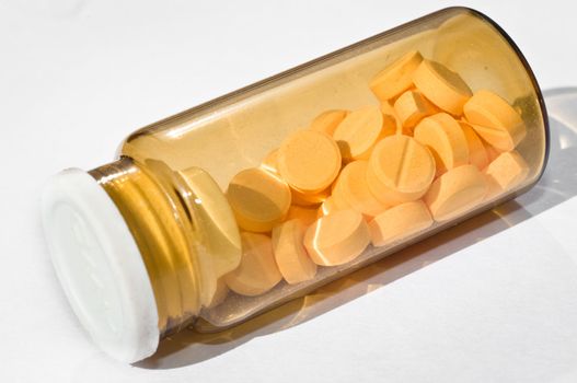 Medicine bottle against white isolated background