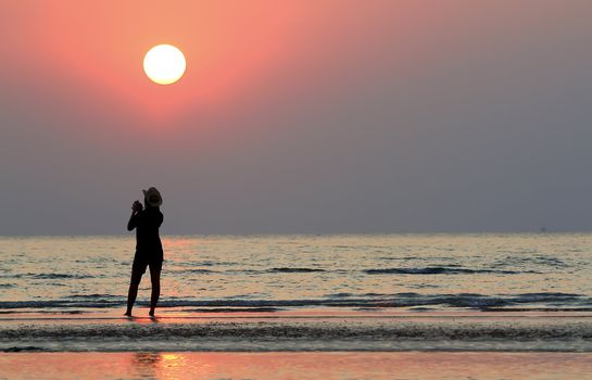 silhouette of woman on the sunset