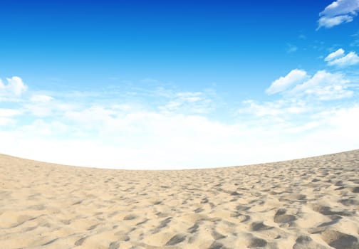 Sand and sky with clouds and sun background