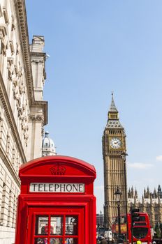 London famous red phone booth, with Big Ben in the background.