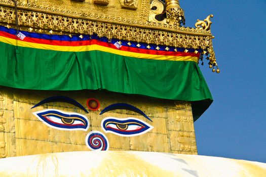 Buddha eyes on stupa of the swayambhunath temple with blue sky in kathmandu, Nepal