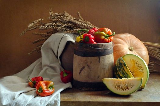 rustic still life of vegetables and wheat sunlit
