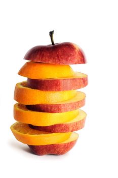 slices of an apple and orange put together to form a hybrid fruit, shot on white in a studio