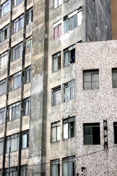 Facade of a rundown building in a poor neighborhood in the center of Sao Paulo, Brazil.