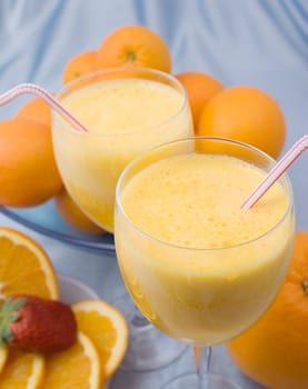 Close-up of crystal glass of fresh orange juice