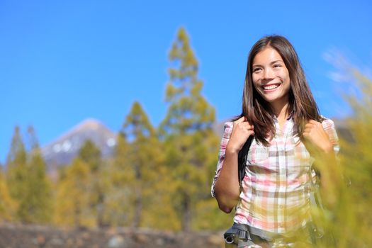 Hiker. Hiking woman portrait of happy female outdoors person during hike in forest on volcano Teide, Tenerife, Canary Islands, Spain, Young mixed race Asian Chinese / Caucasian girl.