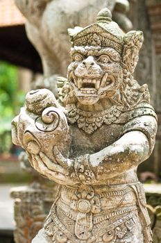 Statue of Balinese demon in Ubud, Indonesia