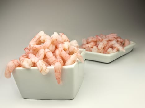 Peeled shrimps, isolated in a white bowl