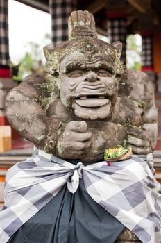 Statue of Balinese demon in Ubud, Indonesia