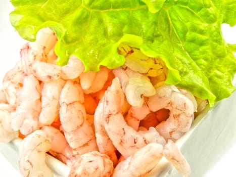 Peeled shrimps, isolated in a white bowl