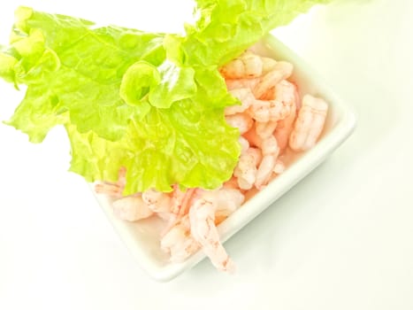 Peeled shrimps, isolated in a white bowl