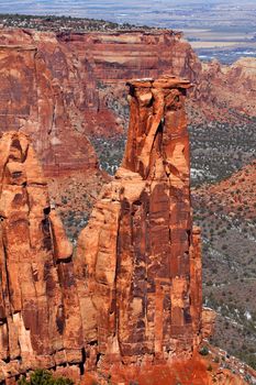 Rock monolith towering over the valley at Colorado National Monument.