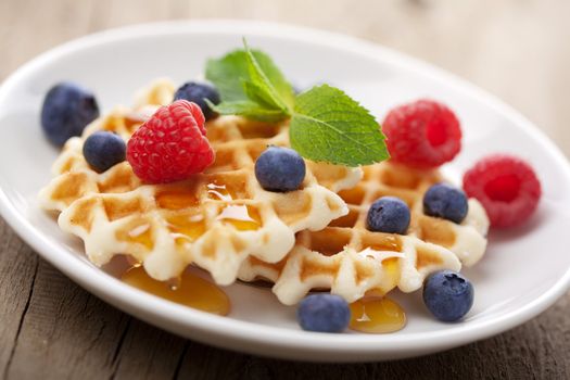 waffles with fresh berries and honey 